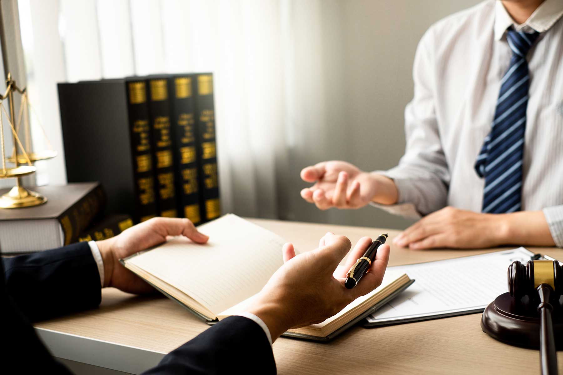 A lawyer and client discussing litigation process during a consultation