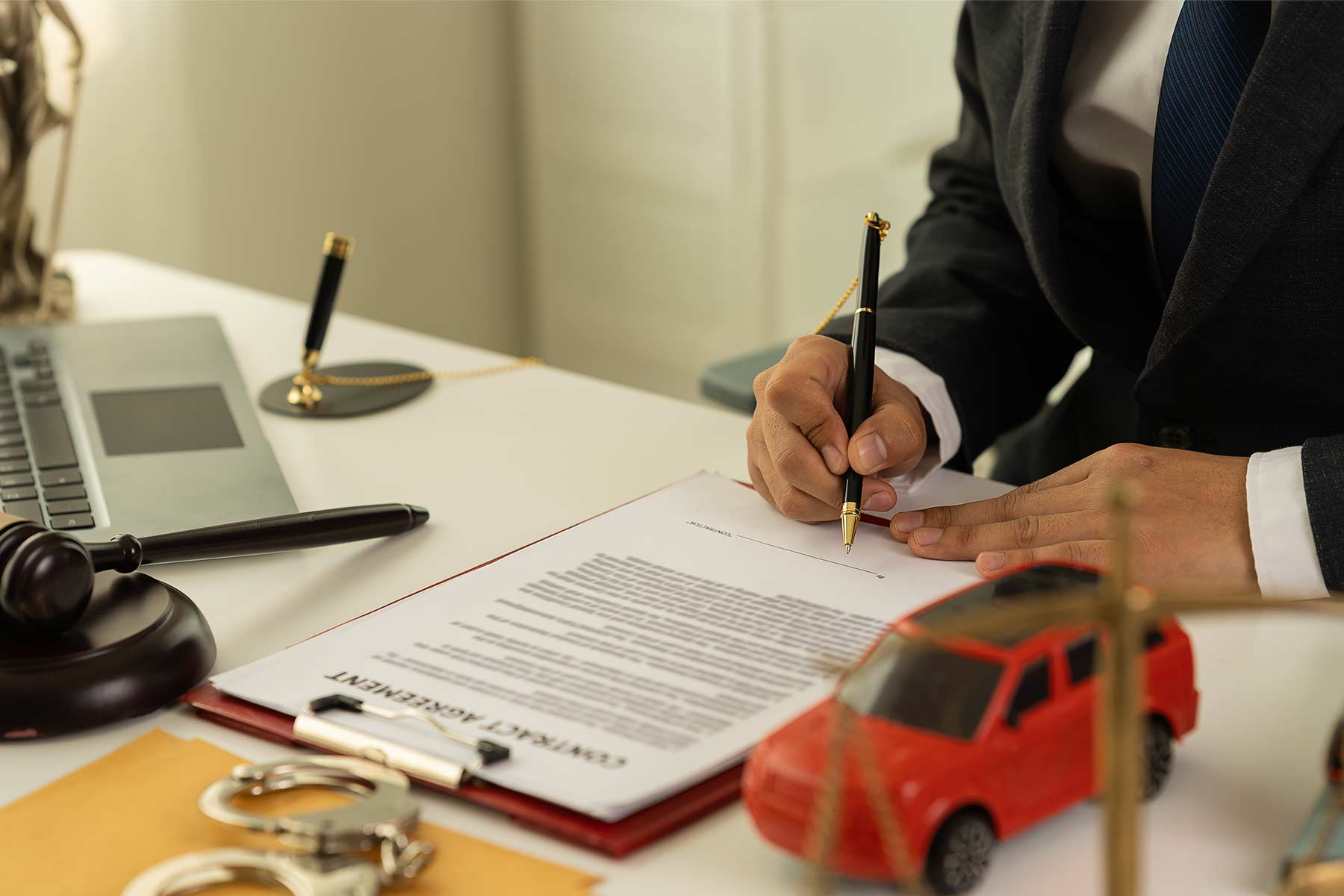 Lawyer signing legal documents for a dispute case in small claims court Lawyer signing legal documents for a dispute case in small claims court